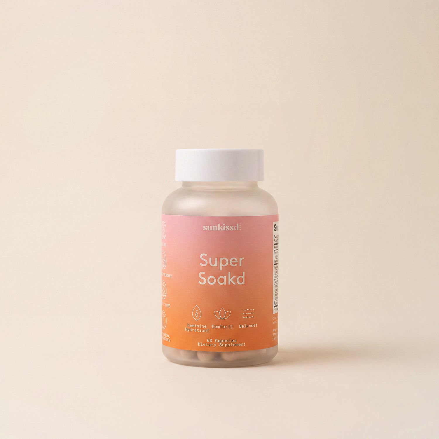 A bottle of munsundl Super Soaked dietary supplement capsules, featuring a pink-to-orange gradient label and a white cap, set against a solid beige background.