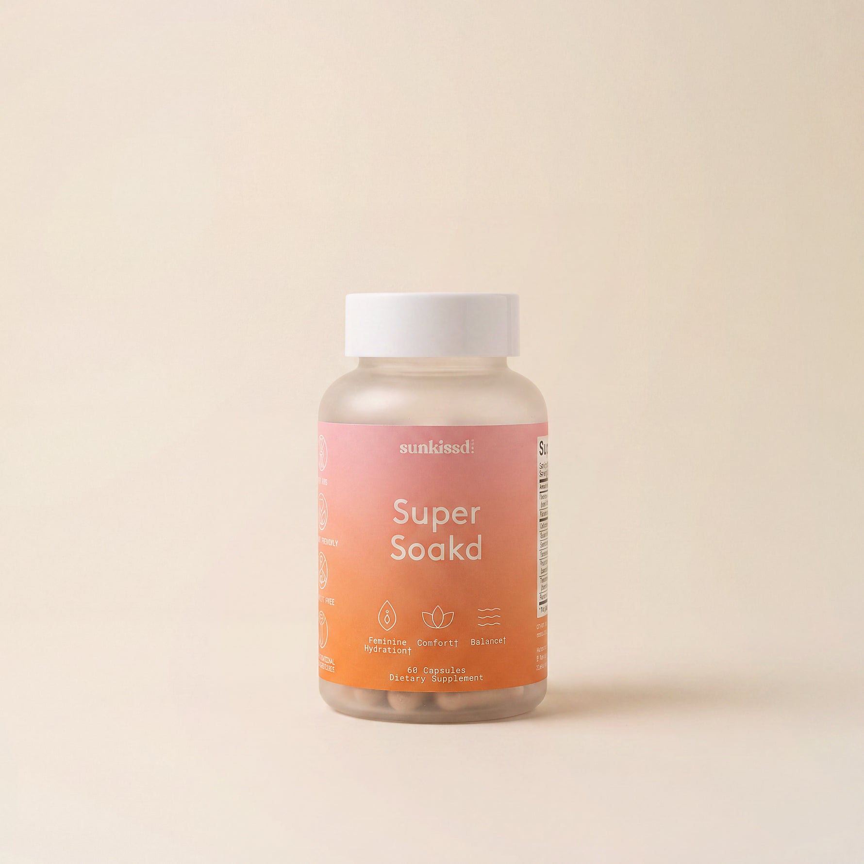 A bottle of munsundl Super Soaked dietary supplement capsules, featuring a pink-to-orange gradient label and a white cap, set against a solid beige background.